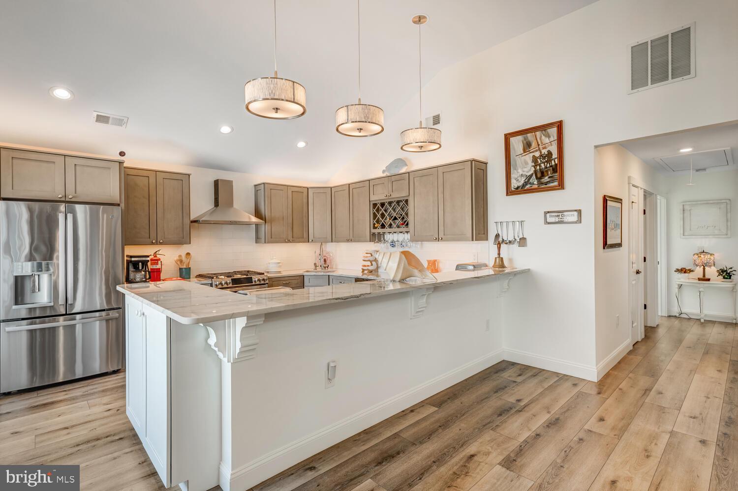 418 Dock Road West Creek, NJ 08092 - Photo 21 of 41 a kitchen with stainless steel appliances granite countertop a refrigerator a stove and a wooden floors