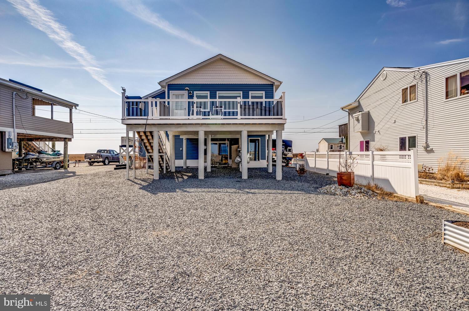 418 Dock Road West Creek, NJ 08092 - Photo 5 of 41 a front view of a building with many windows