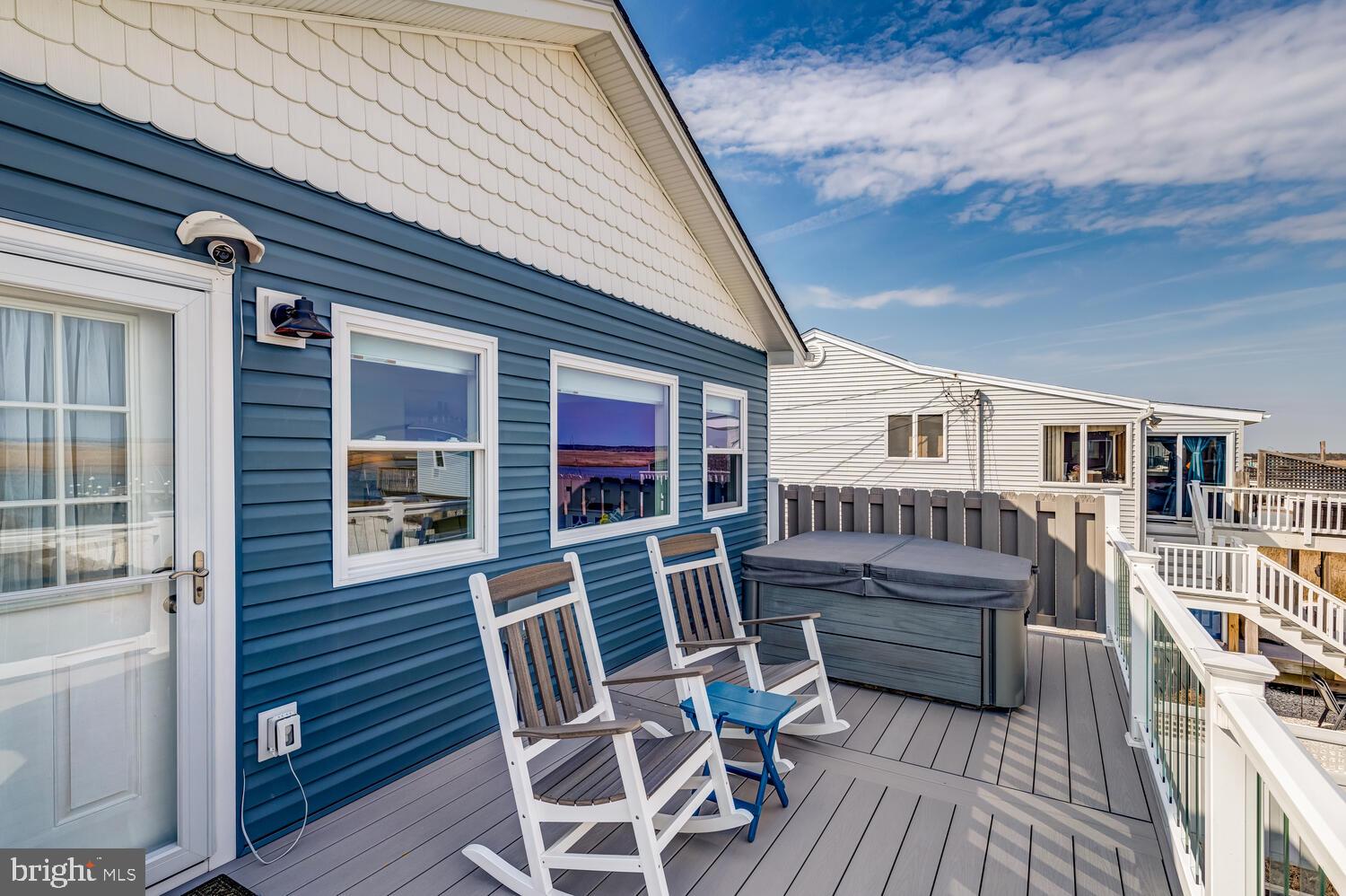 418 Dock Road West Creek, NJ 08092 - Photo 10 of 41 a view of a chair and tables in the balcony