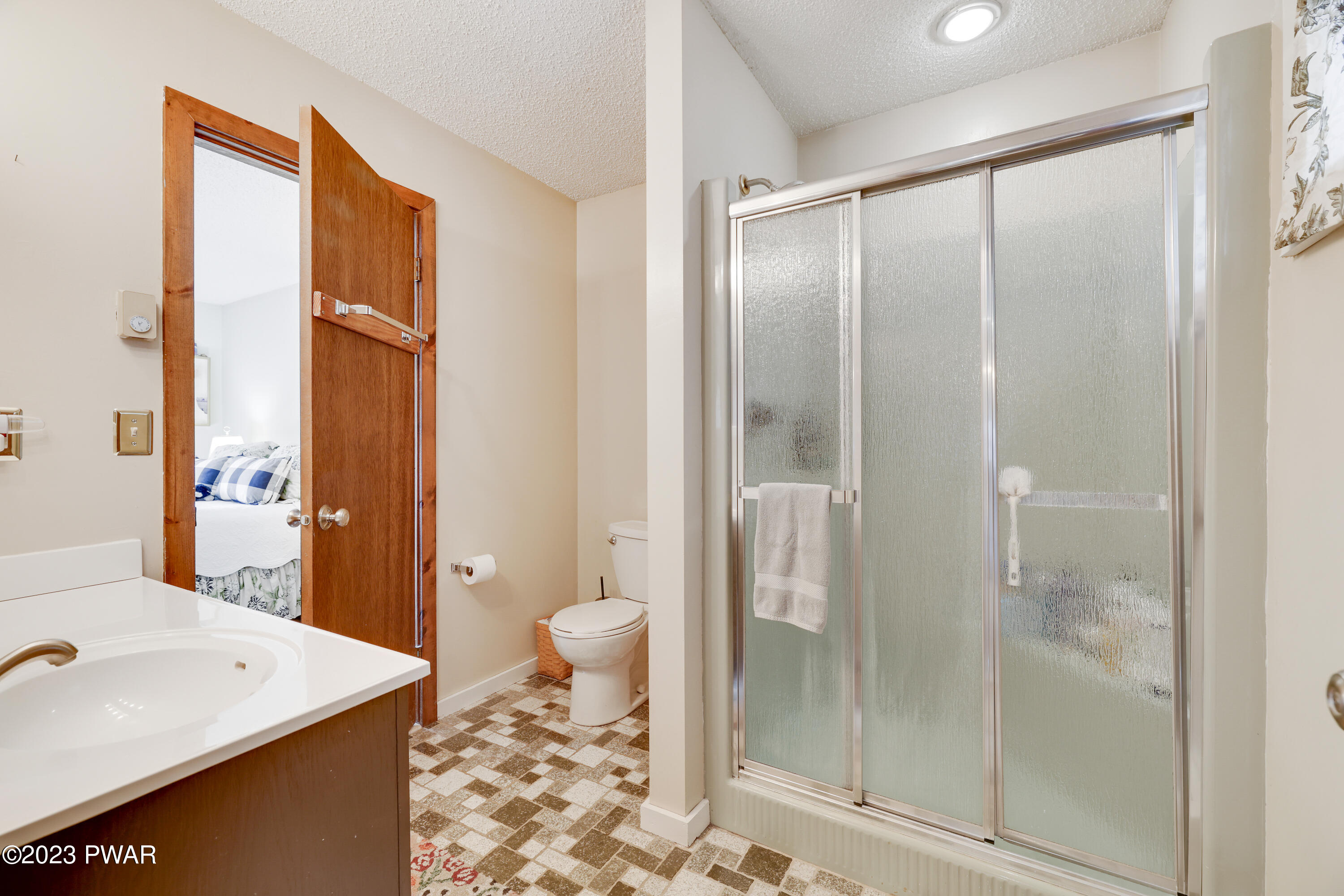 6348 Decker Road Bushkill, PA 18324 - Photo 14 of 36 a bathroom with a sink a toilet and shower