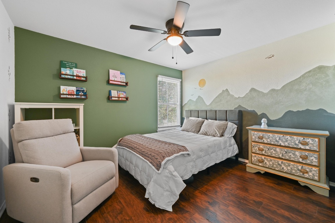 1451 Roxanne's Run Pflugerville, TX 78660 - Photo 13 of 17 a bedroom with a bed couch and a window