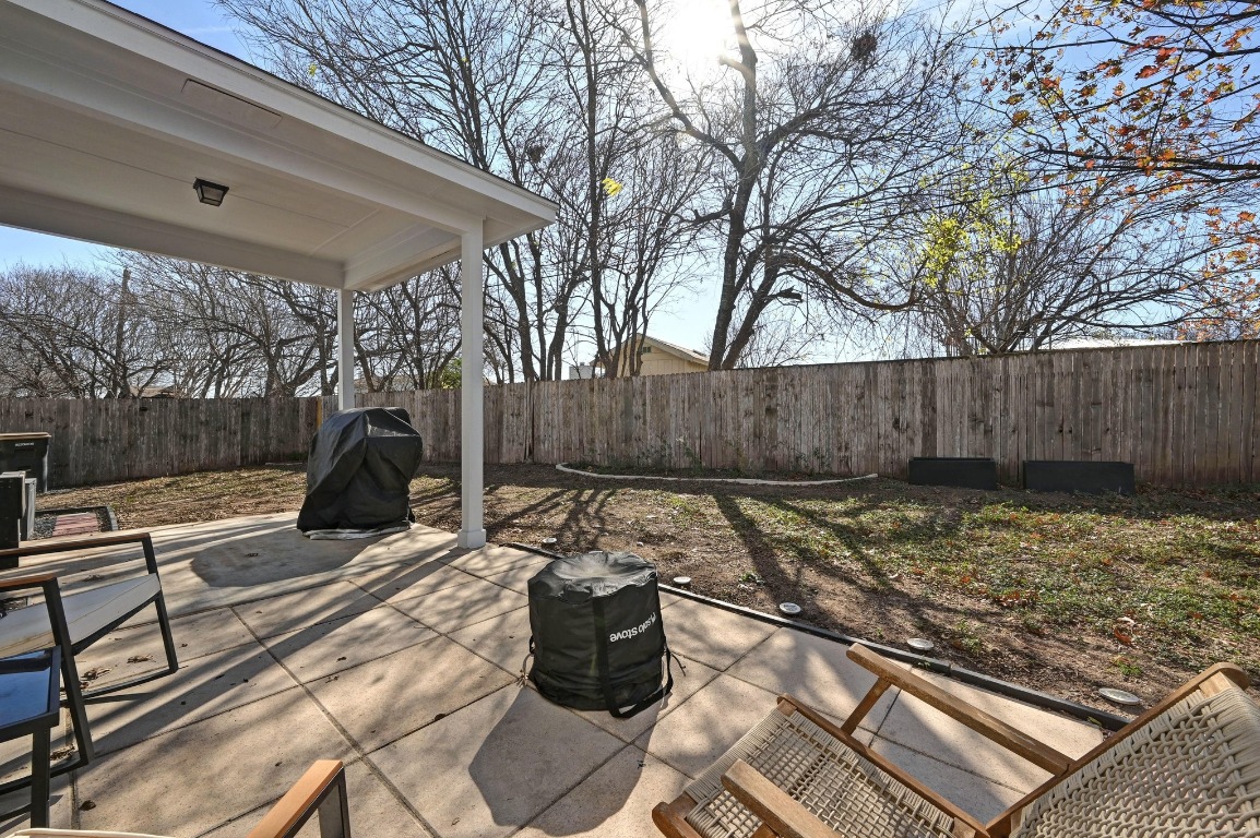 1451 Roxanne's Run Pflugerville, TX 78660 - Photo 16 of 17 a view of a backyard with a patio