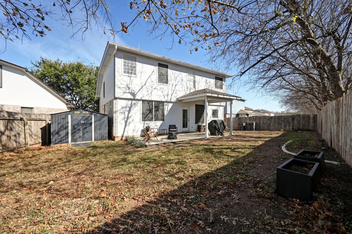 1451 Roxanne's Run Pflugerville, TX 78660 - Photo 17 of 17 a view of a house with backyard stove and sitting area