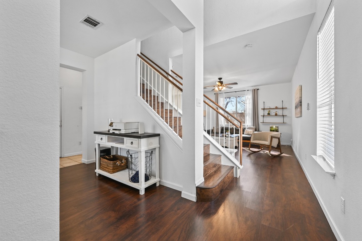 1451 Roxanne's Run Pflugerville, TX 78660 - Photo 3 of 17 a view of entryway and hall with wooden floor