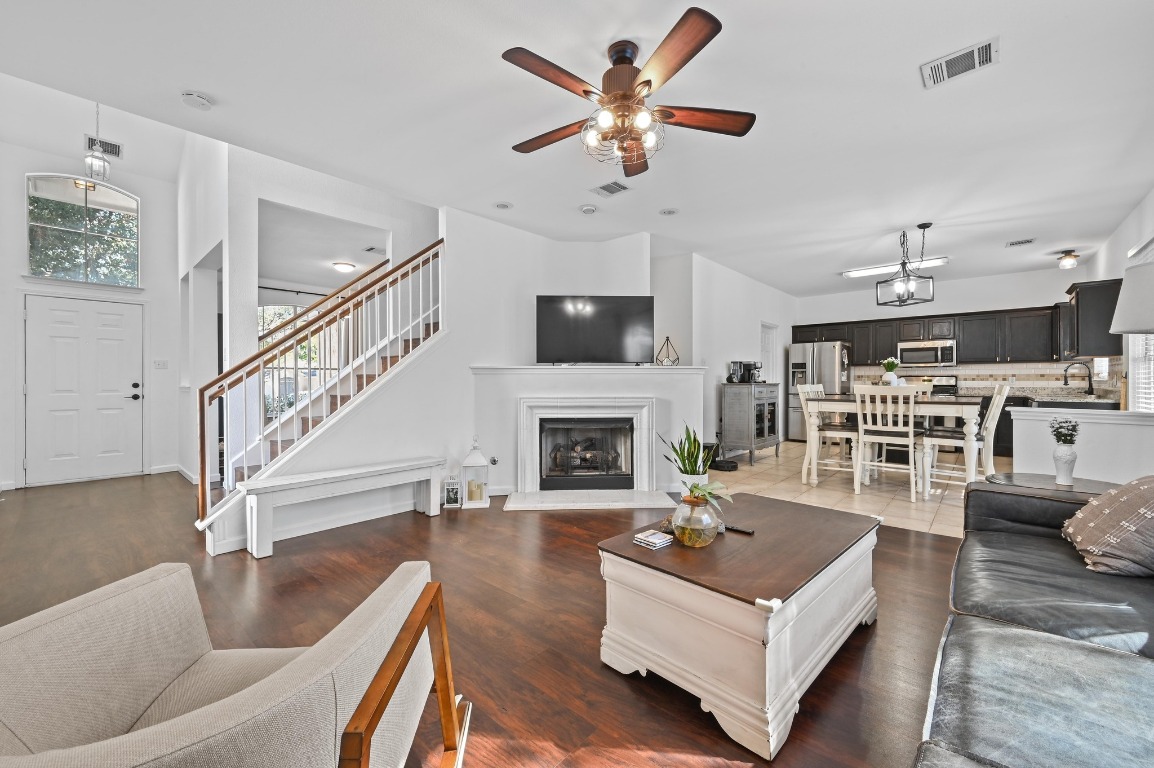 1451 Roxanne's Run Pflugerville, TX 78660 - Photo 5 of 17 a living room with furniture and a fireplace