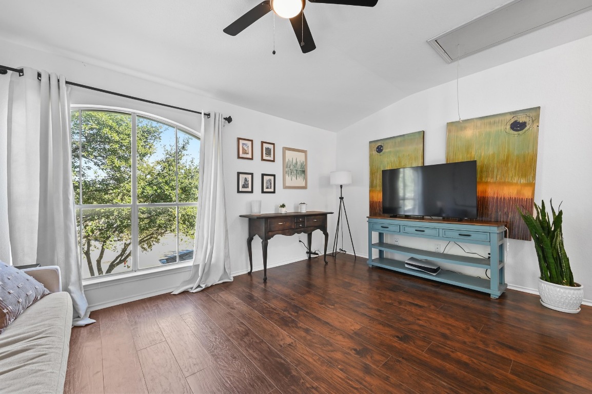 1451 Roxanne's Run Pflugerville, TX 78660 - Photo 9 of 17 a living room with furniture and a flat screen tv