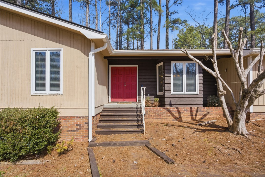 308 Wildwood Road Walhalla, SC 29691 - Photo 18 of 23 This inviting home features a prominent entryway and warm exterior finishes.