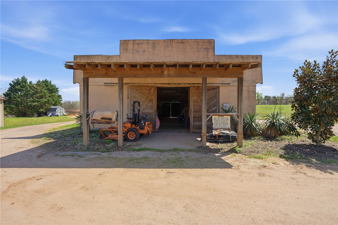 608 Five Forks Road Anderson, SC 29621 - Photo 11 of 43 This structure with rustic wooden barn doors offers a functional outdoor workspace and covered storage.