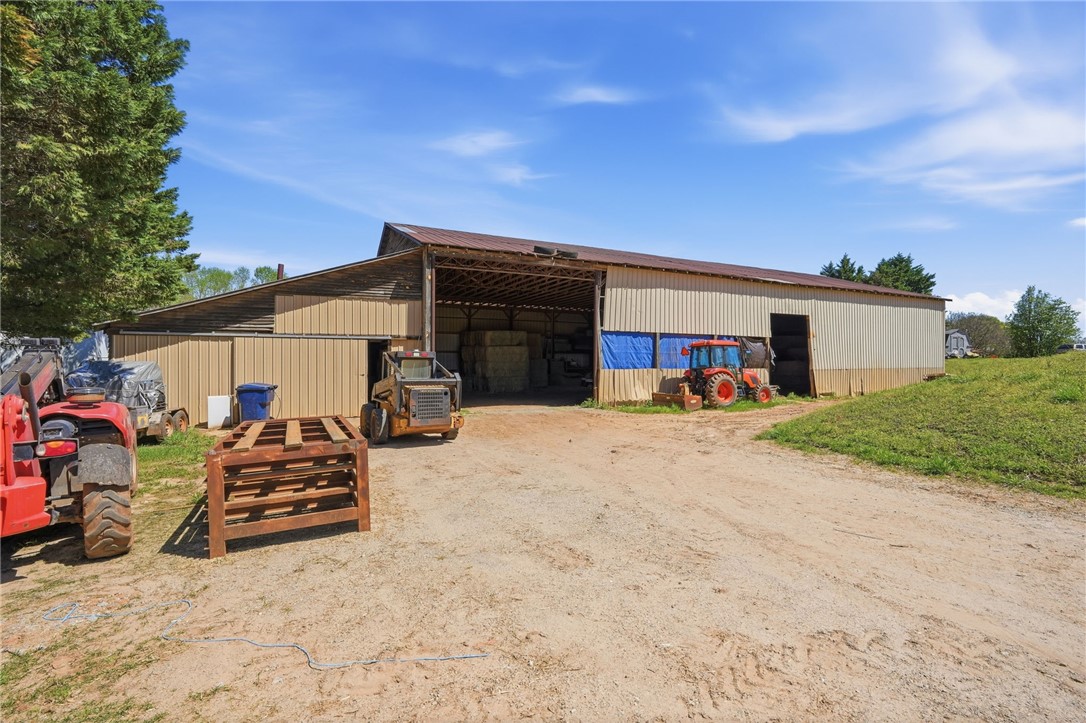 608 Five Forks Road Anderson, SC 29621 - Photo 14 of 43 This spacious barn offers ample storage and versatile utility for any agricultural endeavor.