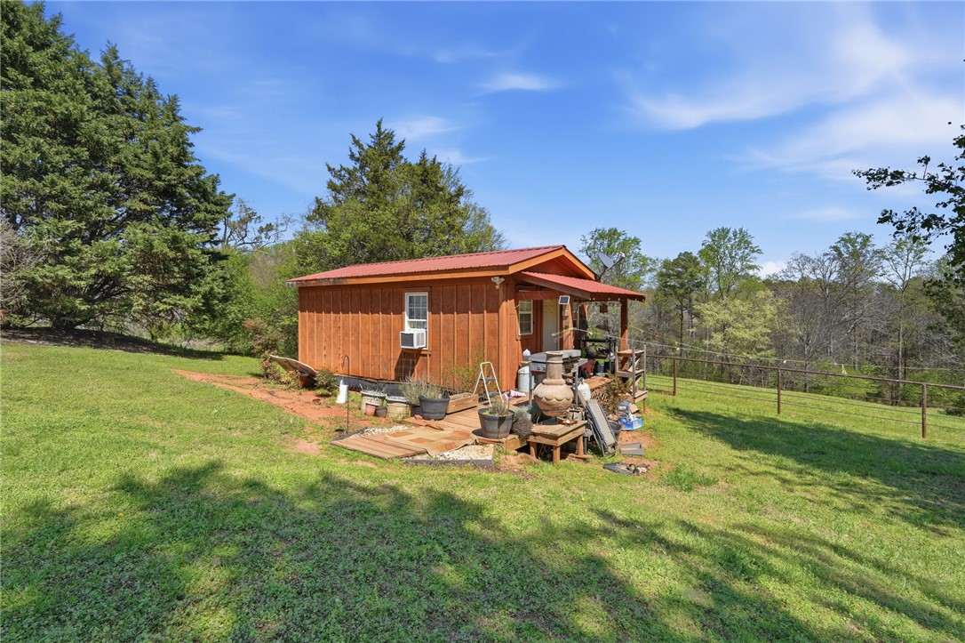 608 Five Forks Road Anderson, SC 29621 - Photo 18 of 43 This charming structure offers a peaceful retreat amidst sprawling green landscapes.