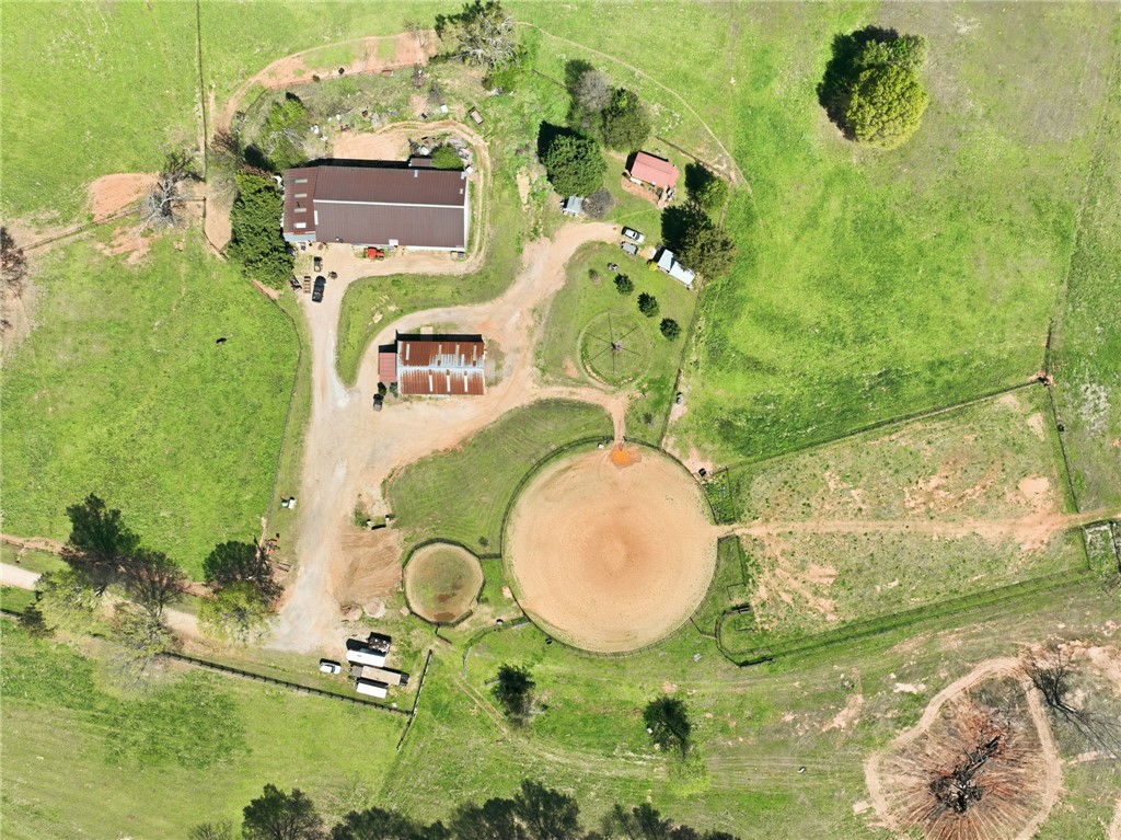 608 Five Forks Road Anderson, SC 29621 - Photo 2 of 43 This expansive aerial view showcases a vibrant green property with multiple structures and a circular arena.