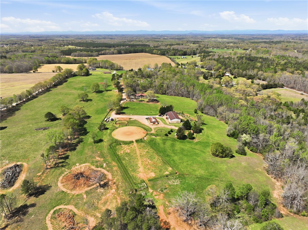 608 Five Forks Road Anderson, SC 29621 - Photo 26 of 43 Vast green acreage unfolds, offering endless possibilities for rural living and equestrian pursuits.