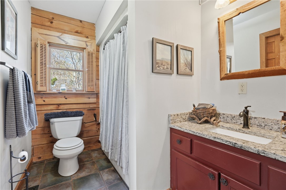 608 Five Forks Road Anderson, SC 29621 - Photo 29 of 43 This cozy bathroom features natural wood accents and a practical vanity with ample counter space.