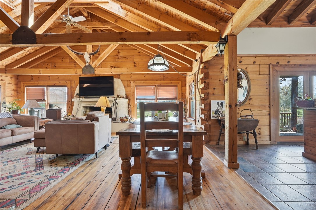 608 Five Forks Road Anderson, SC 29621 - Photo 33 of 43 This expansive great room features vaulted ceilings, exposed wooden beams, and a charming fireplace.