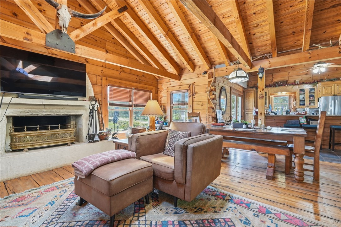 608 Five Forks Road Anderson, SC 29621 - Photo 36 of 43 This inviting interior features a rustic fireplace and expansive wooden elements, perfect for cozy gatherings.
