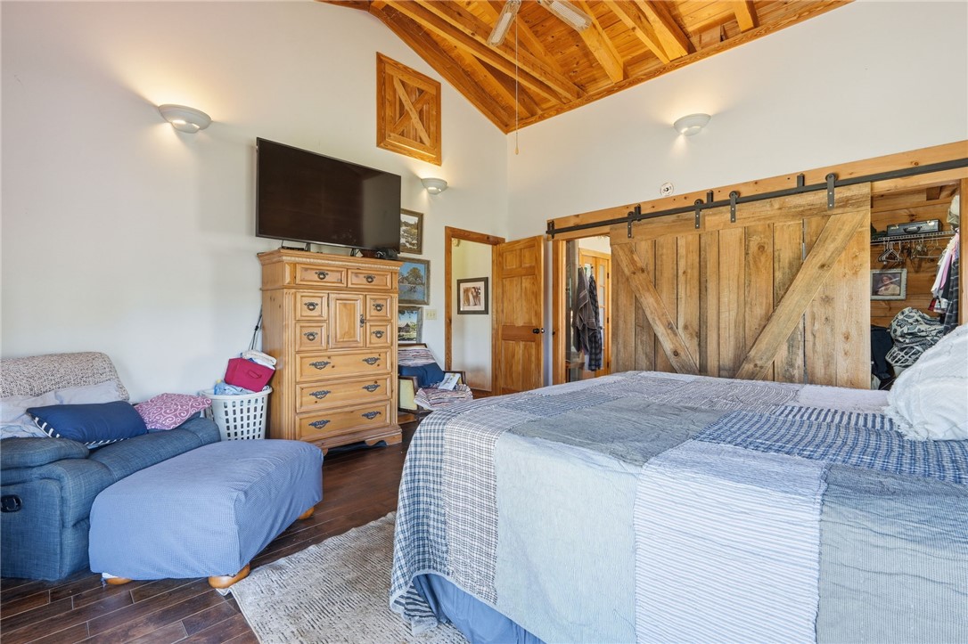 608 Five Forks Road Anderson, SC 29621 - Photo 38 of 43 This spacious bedroom features warm wood accents and vaulted ceilings, creating an inviting retreat.