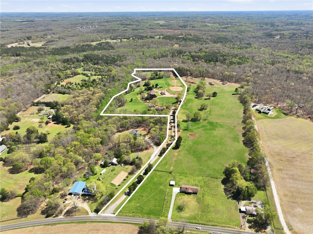 608 Five Forks Road Anderson, SC 29621 - Photo 5 of 43 Expansive acreage provides a verdant backdrop for potential development or a secluded estate.