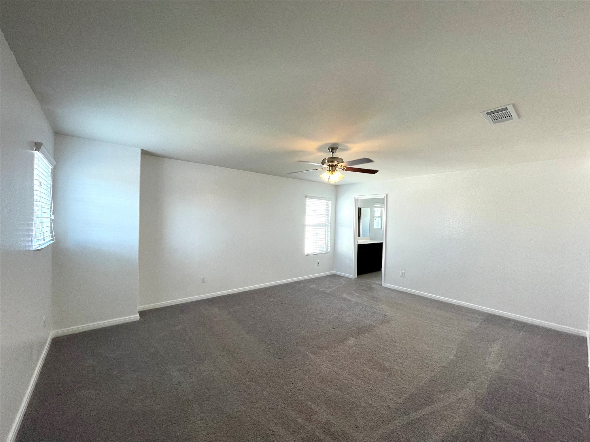 6714 Dayridge Lane Houston, TX 77048 - Photo 11 of 27 an empty room with a windows and fireplace