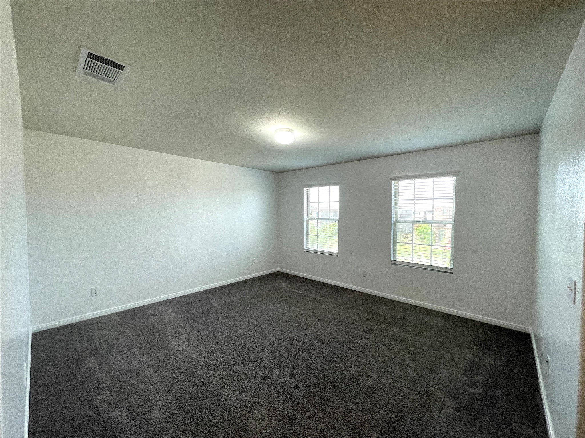 6714 Dayridge Lane Houston, TX 77048 - Photo 19 of 27 an empty room with windows