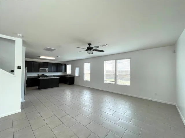 a view of a kitchen with a sink and a stove top oven