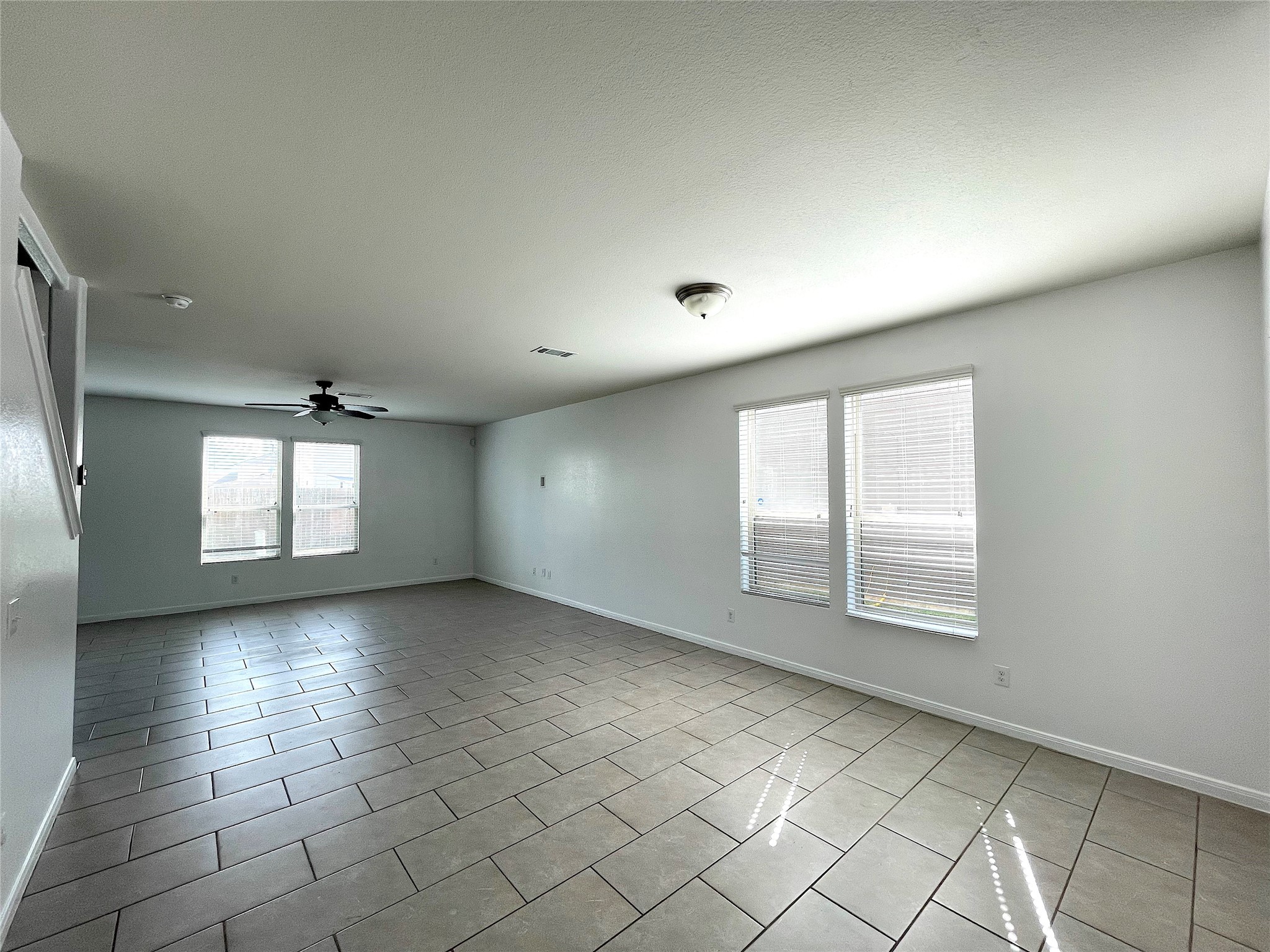 6714 Dayridge Lane Houston, TX 77048 - Photo 7 of 27 an empty room with windows and closet