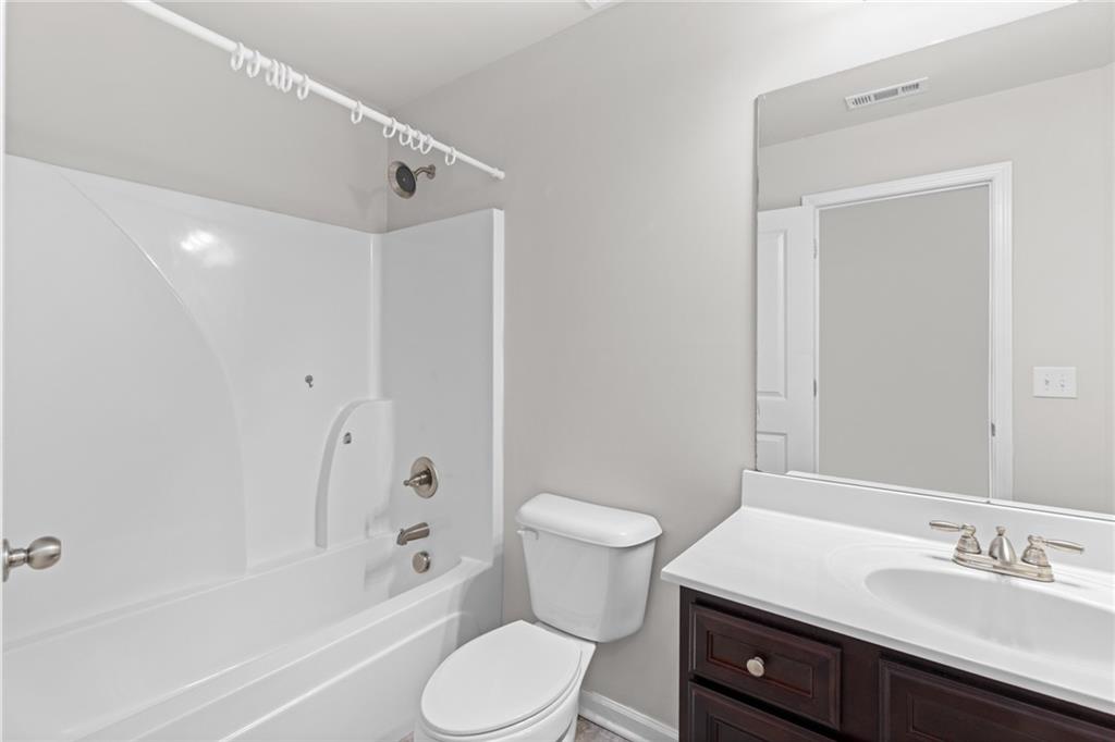 1925 Wheylon Drive Lawrenceville, GA 30044 - Photo 24 of 55 a bathroom with a sink toilet and shower
