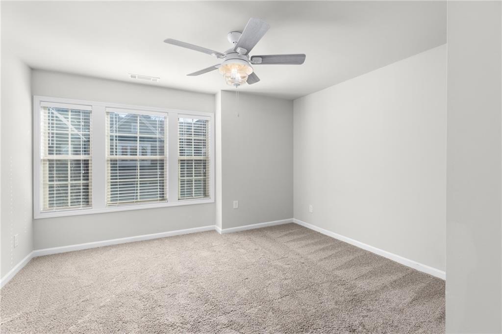 1925 Wheylon Drive Lawrenceville, GA 30044 - Photo 28 of 55 a view of an empty room with a window