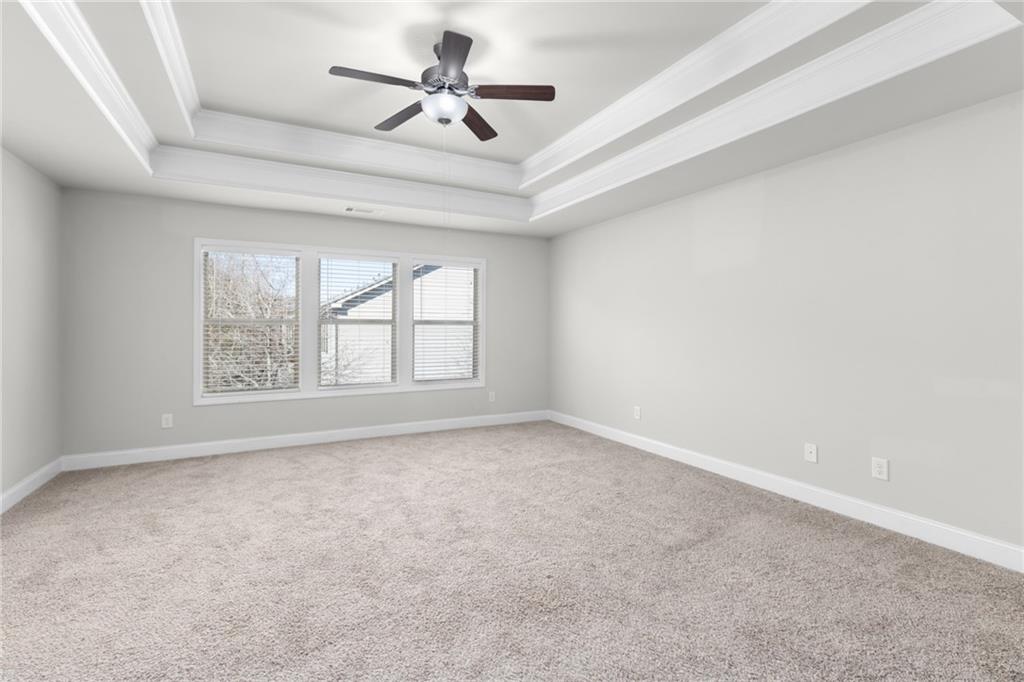 1925 Wheylon Drive Lawrenceville, GA 30044 - Photo 31 of 55 an empty room with a window and a fan