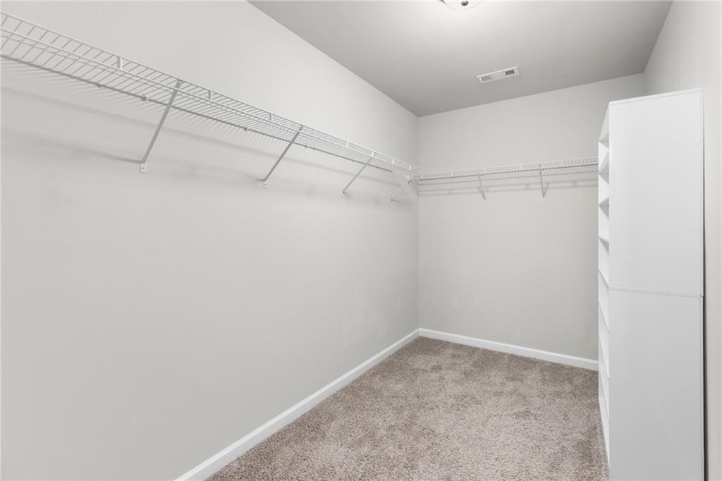 1925 Wheylon Drive Lawrenceville, GA 30044 - Photo 40 of 55 a view of a room with racks on the wall