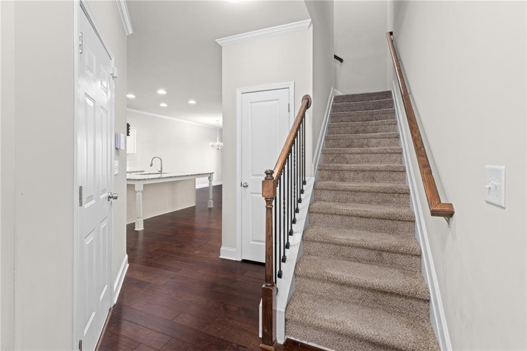 1925 Wheylon Drive Lawrenceville, GA 30044 - Photo 4 of 55 a view of entryway with wooden floor and stairs
