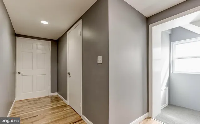 a bathroom with a sink toilet and a mirror