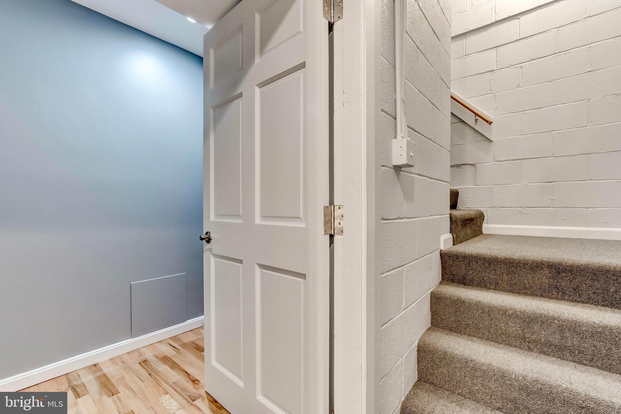 1049 South Charles Street Baltimore, MD 21230 - Photo 33 of 33 a view of staircase with white walls and white door