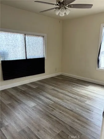 a view of room with window and hardwood floor