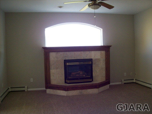 582 34 Road Clifton, CO 81520 - Photo 3 of 14 a living room with a fireplace