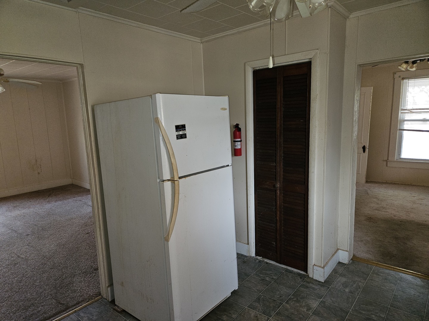 805 West Pine Street Percy, IL 62272 - Photo 18 of 20 a view of a refrigerator in kitchen and an empty room