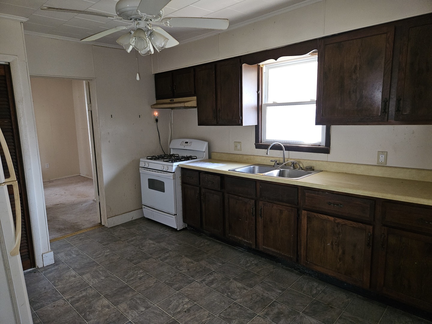 805 West Pine Street Percy, IL 62272 - Photo 19 of 20 a kitchen with a sink window and cabinets
