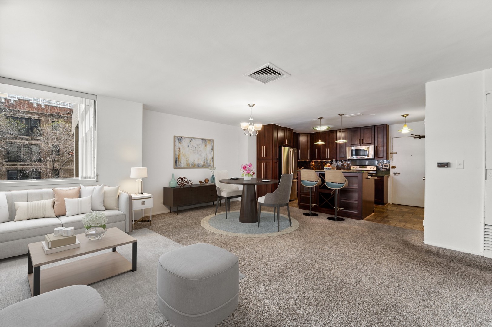 6301 North Sheridan Road, Unit 2U Chicago, IL 60660 - Photo 6 of 12 a living room with furniture and a window