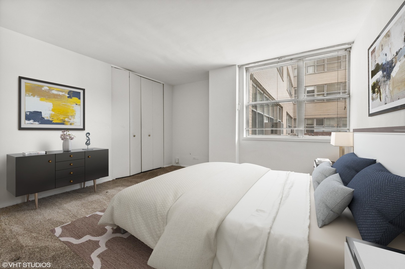 6301 North Sheridan Road, Unit 2U Chicago, IL 60660 - Photo 7 of 12 a bedroom with a bed and a window