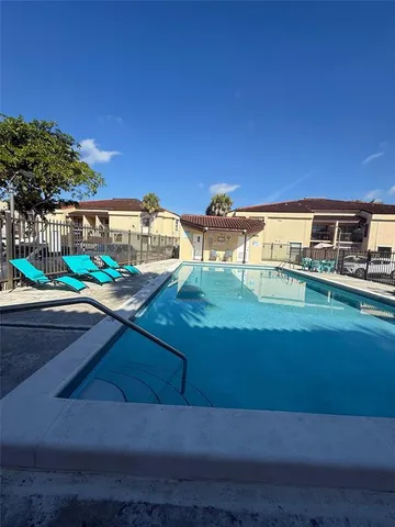 a view of swimming pool with a yard