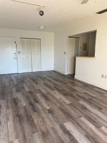 a view of a livingroom with wooden floor