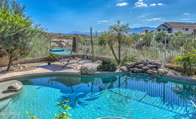 a view of a chairs and table in the patio