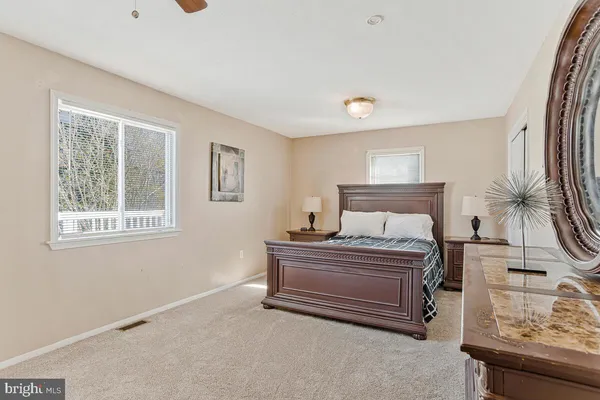 a bedroom with a bed and a table in it
