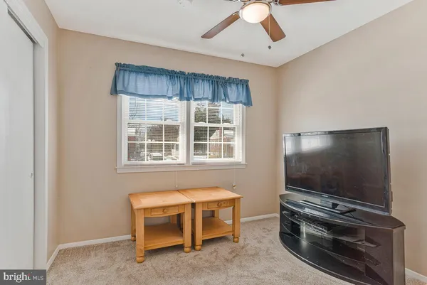 a living room with furniture and flat screen tv