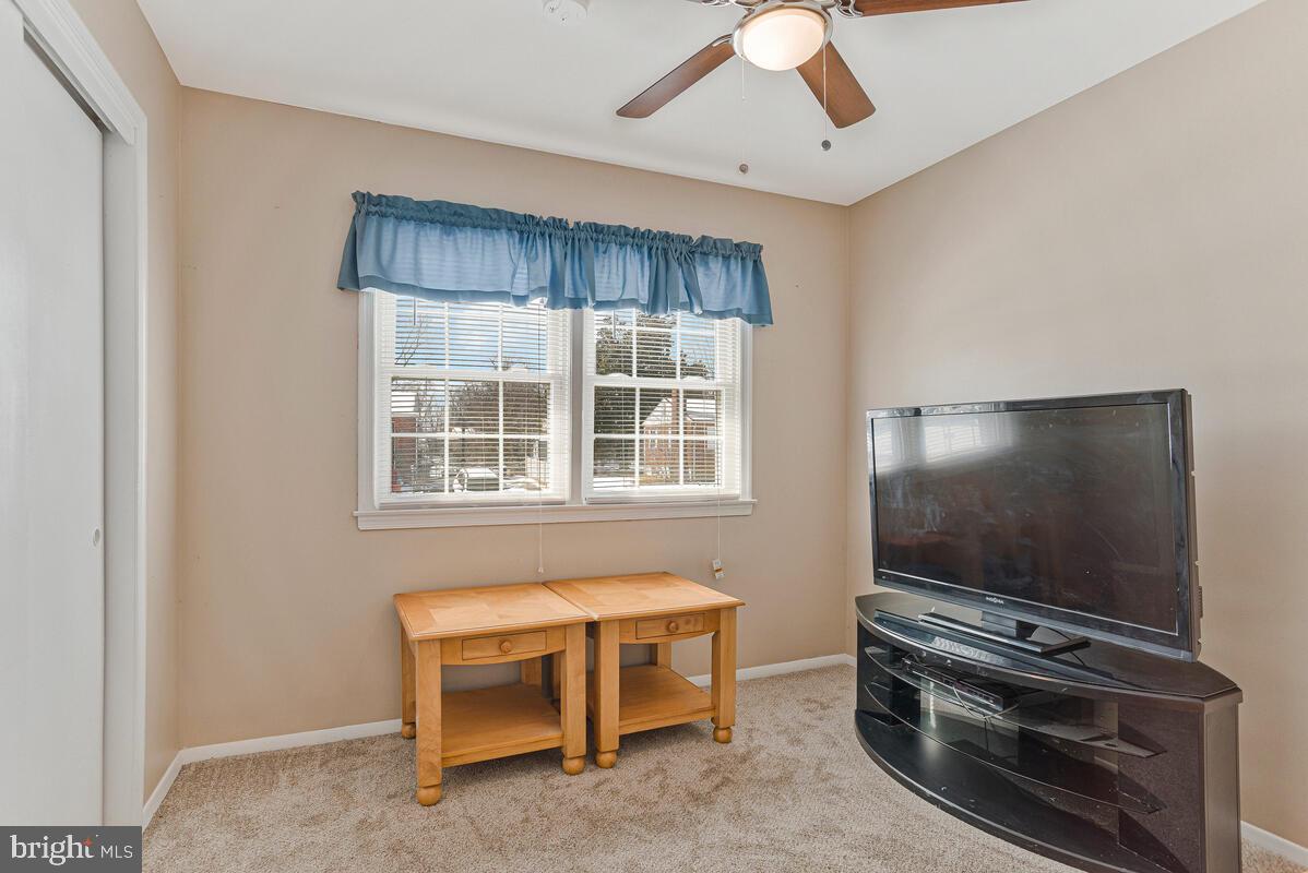 9012 Phyllis Drive Clinton, MD 20735 - Photo 20 of 33 a living room with furniture and flat screen tv