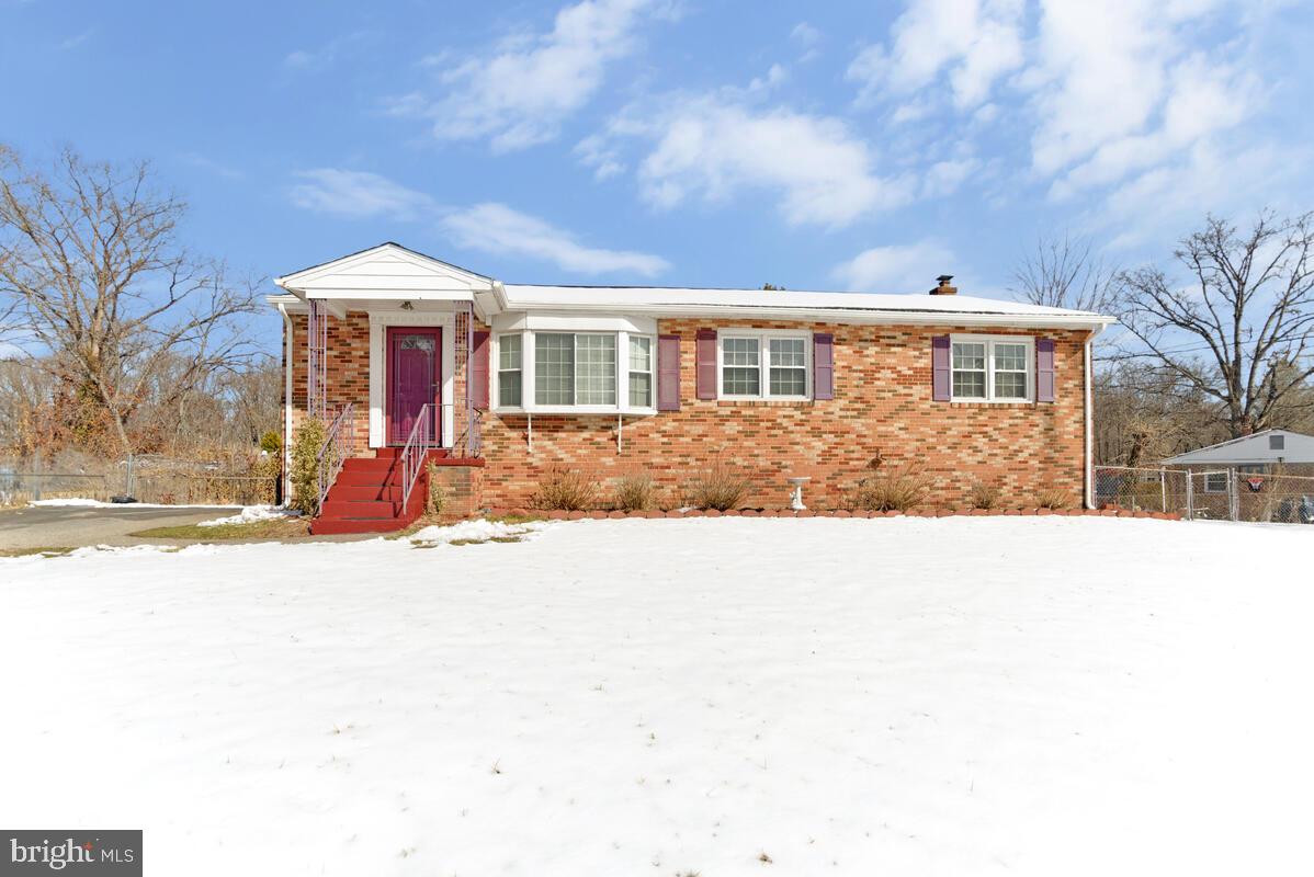 9012 Phyllis Drive Clinton, MD 20735 - Photo 2 of 33 a front view of a house with a yard