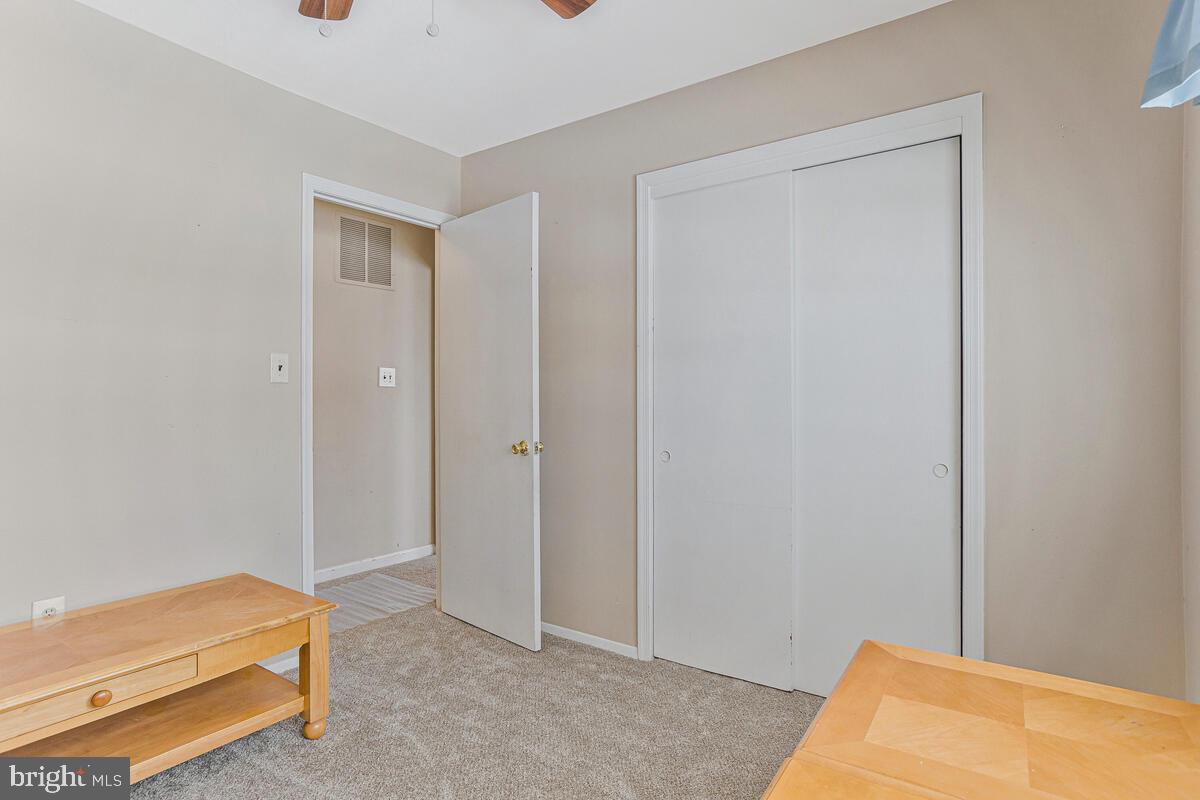 9012 Phyllis Drive Clinton, MD 20735 - Photo 21 of 33 a room that has a bed and a closet
