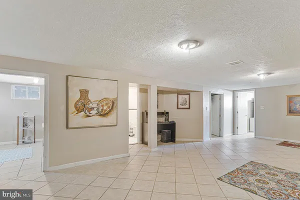 a view of a livingroom with furniture and an entryway
