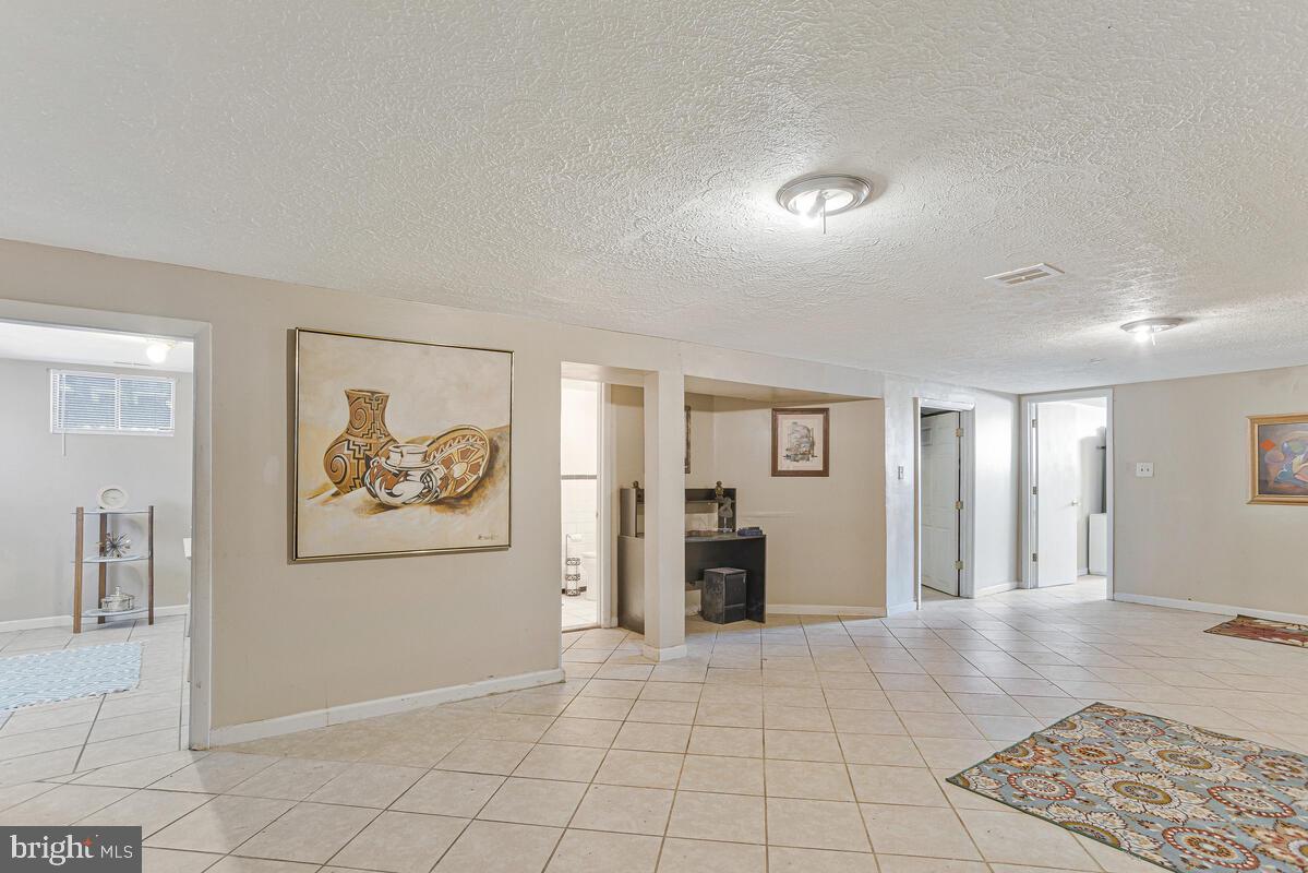 9012 Phyllis Drive Clinton, MD 20735 - Photo 22 of 33 a view of a livingroom with furniture and an entryway
