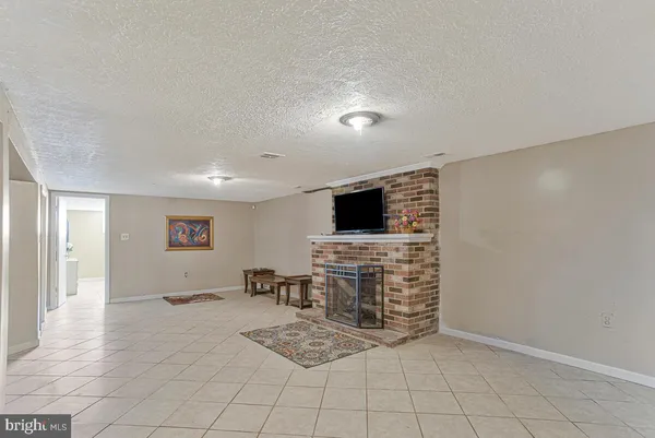a view of kitchen with microwave and furniture