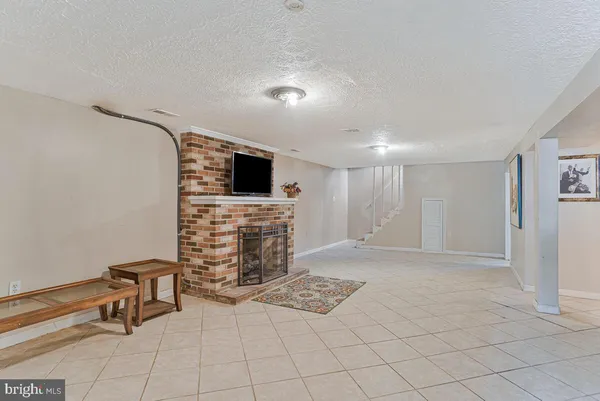 a view of livingroom with furniture and a fireplace